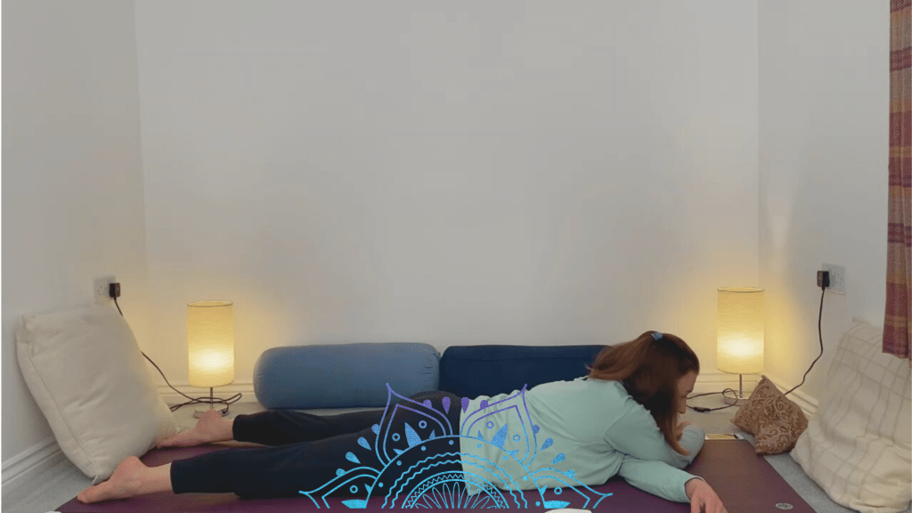 Closed wing yin yoga pose to release shoulders and trapezius
